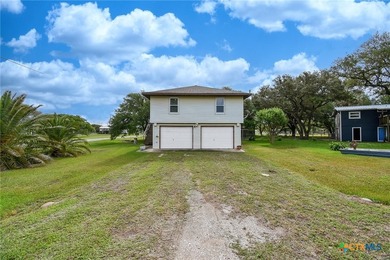 Bay breeze and shade trees await at 225 Swallow Dr. in gated - photo 2