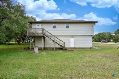 Bay breeze and shade trees await at 225 Swallow Dr. in gated - photo 5