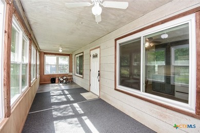 Bay breeze and shade trees await at 225 Swallow Dr. in gated - photo 10