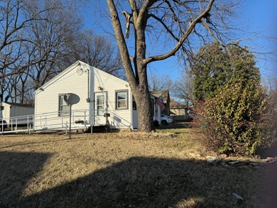 Welcome home to this charming corner-lot bungalow in the heart