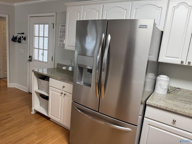 Welcome to this stunning 4 bedroom, 2.5 bathroom full brick home