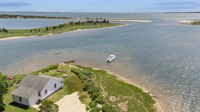 Tucked away in a secluded waterfront setting, this charming - photo 1