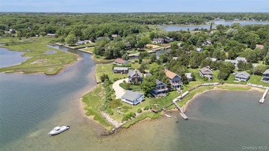 Tucked away in a secluded waterfront setting, this charming - photo 4