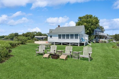 Tucked away in a secluded waterfront setting, this charming - photo 5