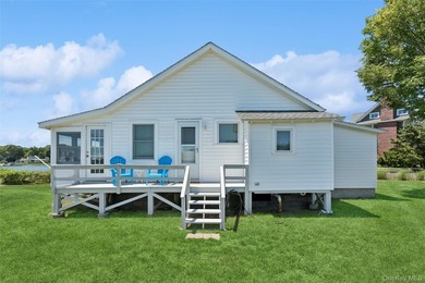 Tucked away in a secluded waterfront setting, this charming - photo 6