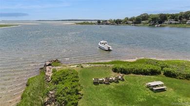 Tucked away in a secluded waterfront setting, this charming - photo 7