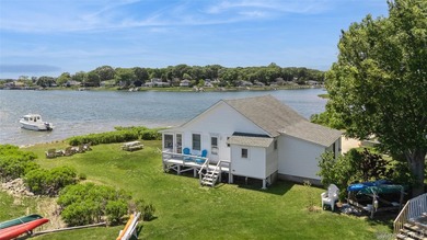 Tucked away in a secluded waterfront setting, this charming - photo 8