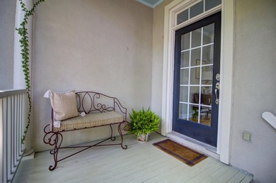 Nestled under mature oak trees and surrounded by gardens, you'll - photo 3