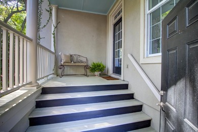 Nestled under mature oak trees and surrounded by gardens, you'll - photo 4