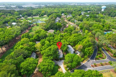 Nestled under mature oak trees and surrounded by gardens, you'll - photo 10