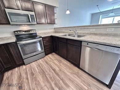 This well-located three-bedroom, two-and-a-half-bath condo - photo 3