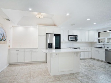 Beautifully updated 2BR/2BA first-floor condo with stunning lake - photo 3