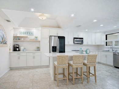 Beautifully updated 2BR/2BA first-floor condo with stunning lake - photo 4