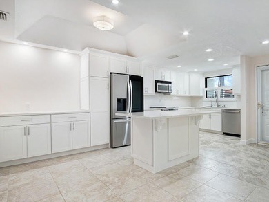 Beautifully updated 2BR/2BA first-floor condo with stunning lake - photo 5