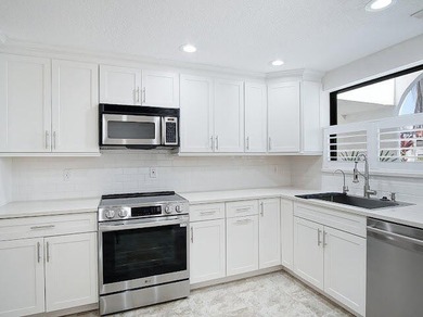 Beautifully updated 2BR/2BA first-floor condo with stunning lake - photo 7