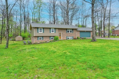 This spacious Bi-level home is on wooded lot with view of Lake - Lake Home For Sale in Santa Claus, Indiana