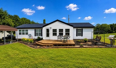 Nestled on 8 beautiful acres in Eubank, Kentucky, this charming - photo 1