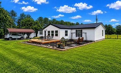 Nestled on 8 beautiful acres in Eubank, Kentucky, this charming - photo 2