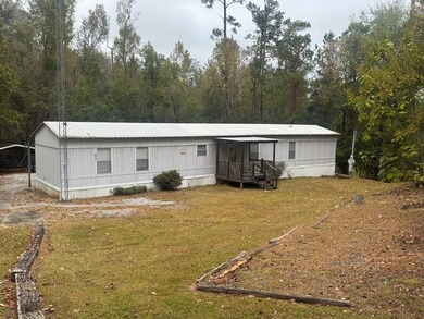 Well kept home in Riverview Forest Estates. Gated community with - photo 1