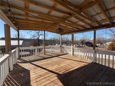 Cute as a button! This cozy cabin is perfectly positioned on a