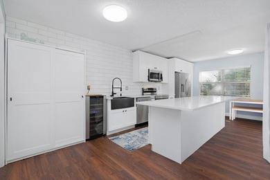 Updated 2 bedroom, 2.5-bathroom DiVosta built townhouse in the - photo 7