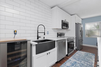 Updated 2 bedroom, 2.5-bathroom DiVosta built townhouse in the - photo 9