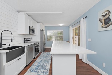 Updated 2 bedroom, 2.5-bathroom DiVosta built townhouse in the - photo 10