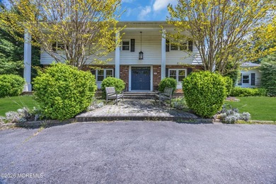 Stately center hall colonial set on an oversized 1.3-acre lot in - photo 1