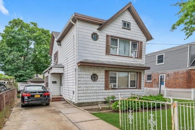 This detached two-family features a 3-bedroom/1-bathroom unit - photo 3