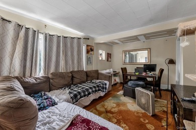 This detached two-family features a 3-bedroom/1-bathroom unit - photo 4