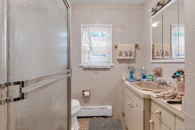 This detached two-family features a 3-bedroom/1-bathroom unit - photo 7