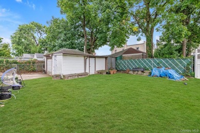 This detached two-family features a 3-bedroom/1-bathroom unit - photo 10