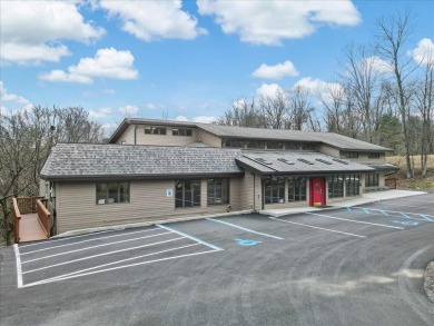 With Parking lot expanded, repaved, and restriped, retaining