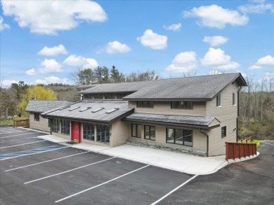 With Parking lot expanded, repaved, and restriped, retaining