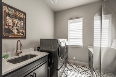 Stunning 4-bedroom, 3-bath modern farmhouse in the gated