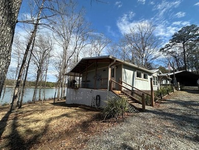 REDUCED!!! Experience ultimate lakeside living on 952 feet of - photo 1