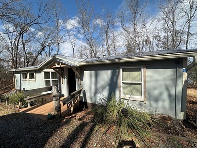 REDUCED!!! Experience ultimate lakeside living on 952 feet of - photo 2