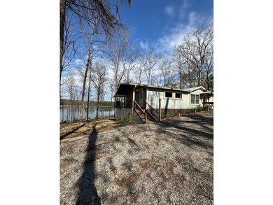 REDUCED!!! Experience ultimate lakeside living on 952 feet of - photo 5