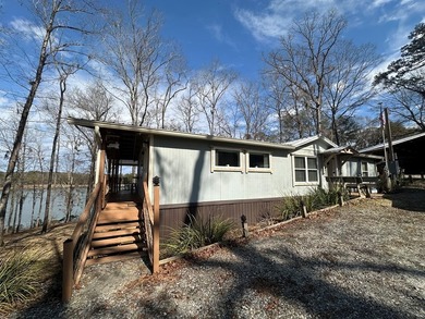 REDUCED!!! Experience ultimate lakeside living on 952 feet of - photo 7