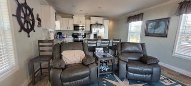 Welcome to effortless waterfront living in the peaceful, golf - photo 18