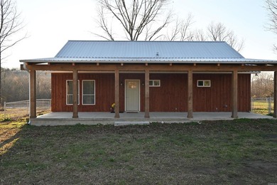 Situated on the banks of the beautiful, clear Caddo River, this - photo 8
