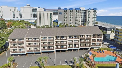 Top-floor end unit with beautiful beach views and excellent - photo 1