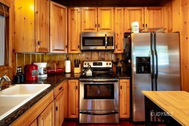 Perched on a gently sloping hillside among granite boulders and - photo 16