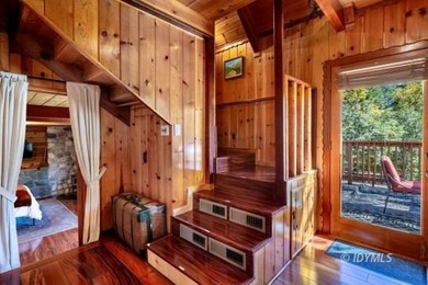 Perched on a gently sloping hillside among granite boulders and - photo 17