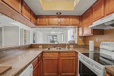 Walk to the beach from this charming top floor end unit 2 bed 2 - photo 11