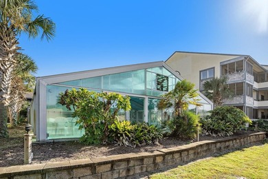 Walk to the beach from this charming top floor end unit 2 bed 2 - photo 17