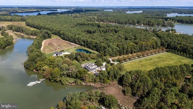 Set along the peaceful waters of Caulk Cove, this extraordinary - photo 2