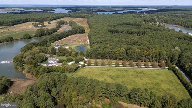 Set along the peaceful waters of Caulk Cove, this extraordinary - photo 10