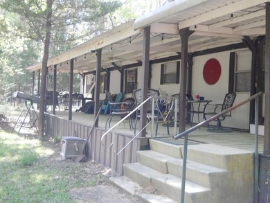 Escape to 15.73 acres of pure East Texas freedom- surrounded on - photo 1
