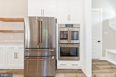 Welcome to Woodridge, where refined lake living meets modern - photo 17